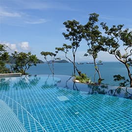 view of pool and ocean