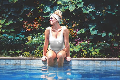 girl sitting on pool